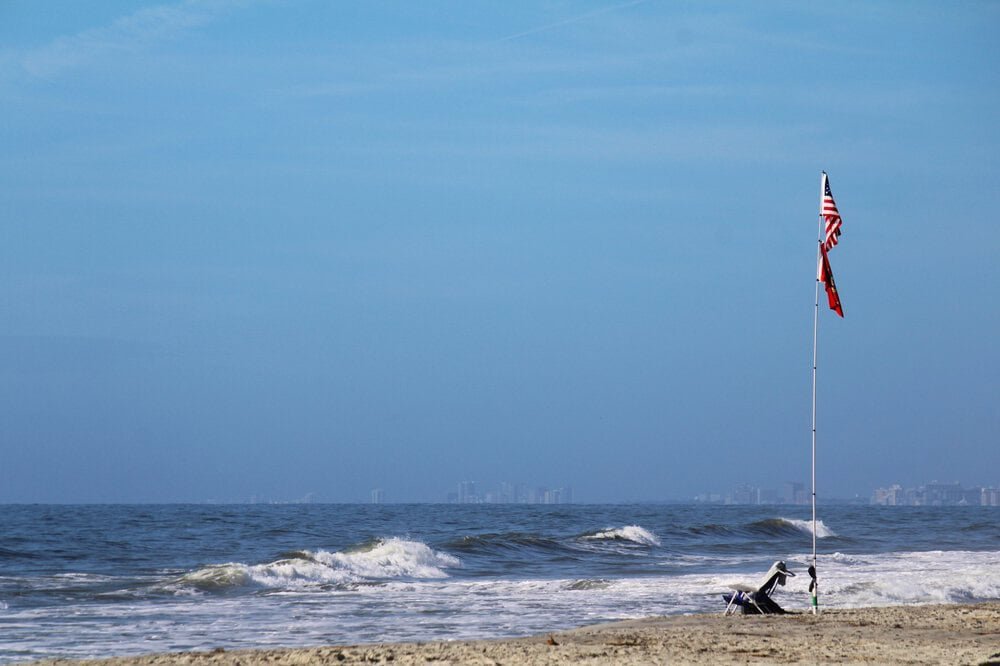 Beach with flag, summer travel 2026