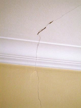 a picture showing crack from ceiling to wall