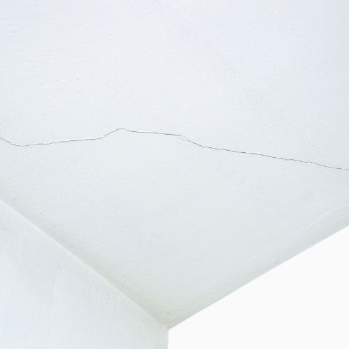 a picture showing diagonal ceiling crack